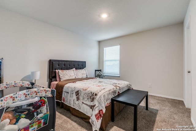 bedroom featuring light colored carpet