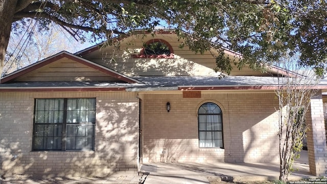 view of property exterior featuring a patio area