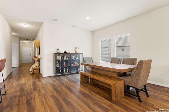 dining area featuring dark hardwood / wood-style flooring