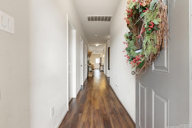 corridor with dark hardwood / wood-style floors
