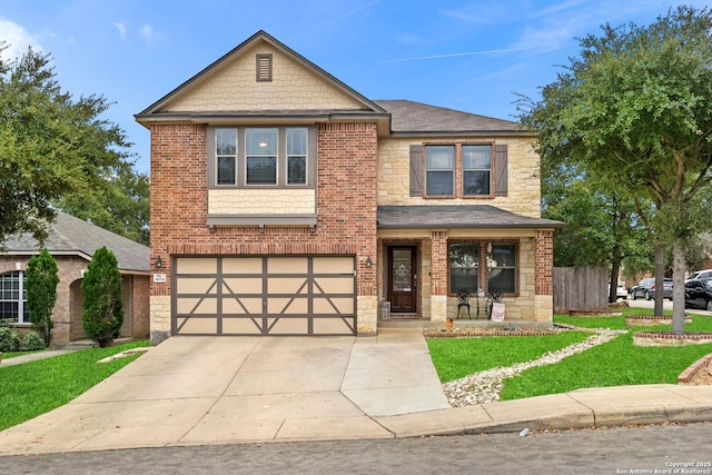 view of front of house featuring a garage and a front lawn