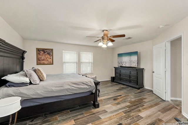 bedroom with ceiling fan and wood-type flooring