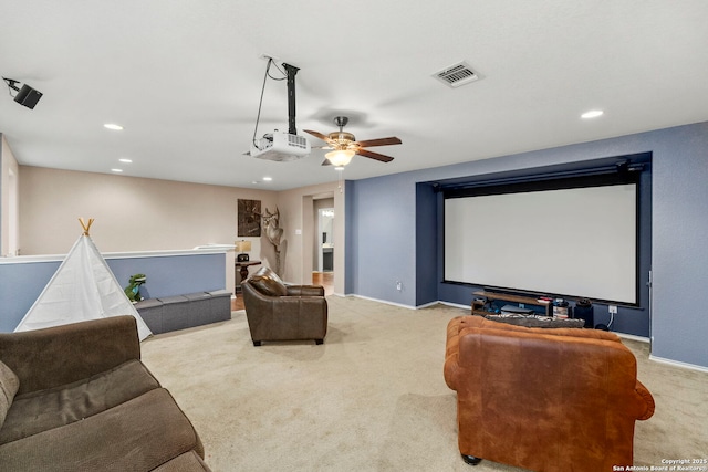 home theater featuring light carpet and ceiling fan