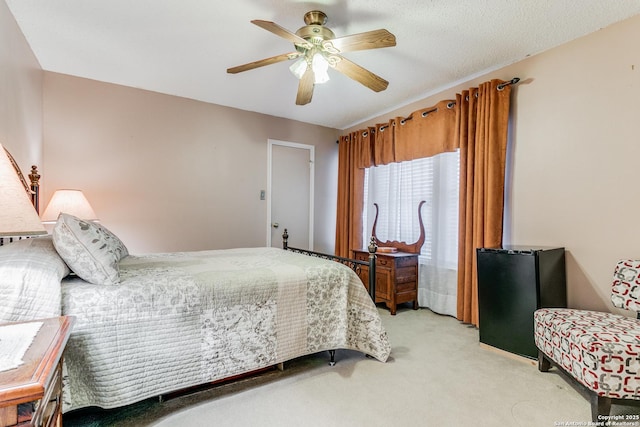 bedroom featuring ceiling fan and light colored carpet