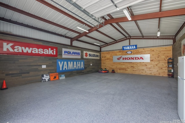 garage featuring wooden walls