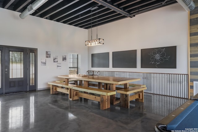 dining room featuring a high ceiling