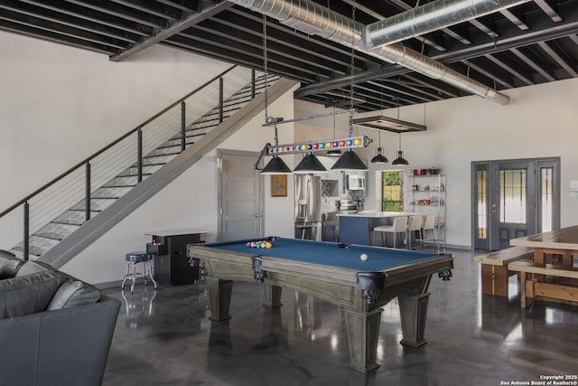 recreation room featuring bar area and billiards