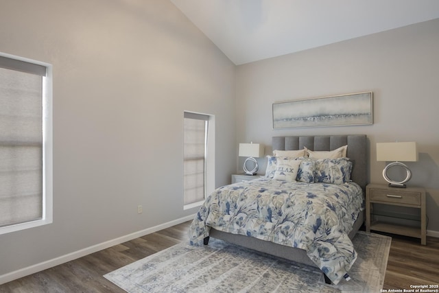 bedroom featuring vaulted ceiling and dark hardwood / wood-style flooring