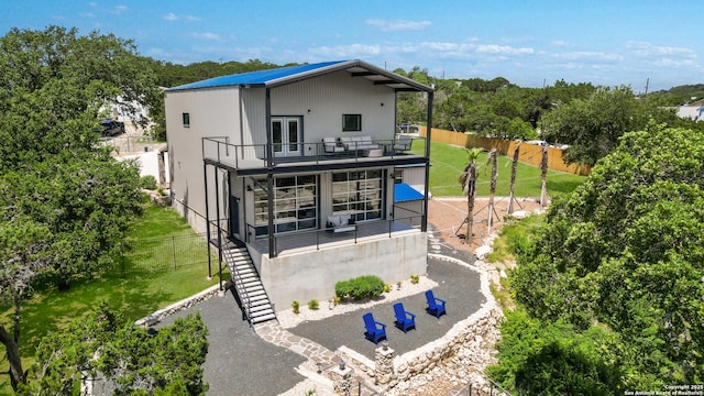 rear view of house featuring a balcony