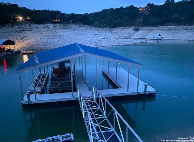 dock area with a water view