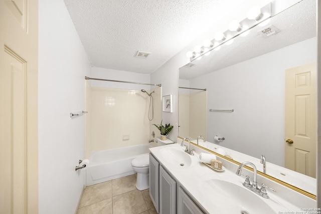 full bathroom featuring toilet, shower / bath combination, tile patterned flooring, a textured ceiling, and vanity