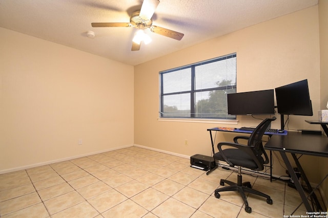 tiled office space with ceiling fan and a textured ceiling