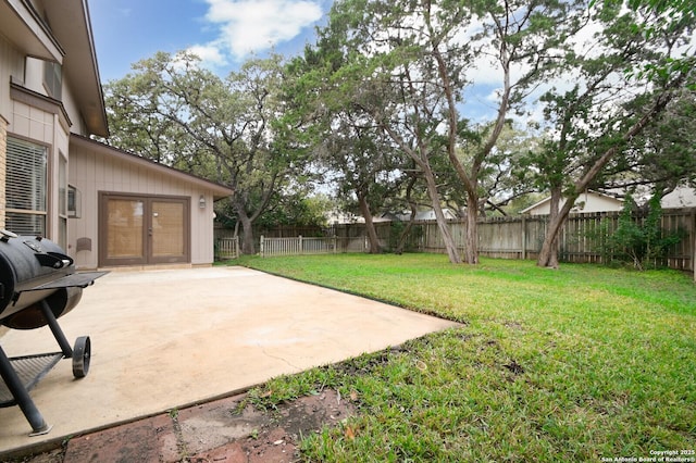 view of yard featuring french doors and a patio area