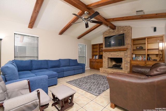 tiled living room featuring ceiling fan, vaulted ceiling with beams, and a fireplace