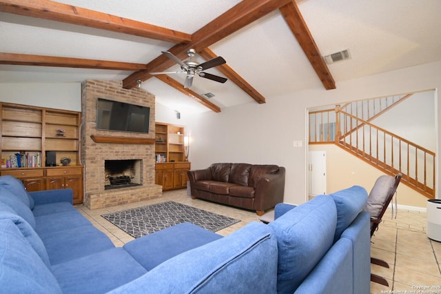 tiled living room with a brick fireplace, lofted ceiling with beams, and ceiling fan