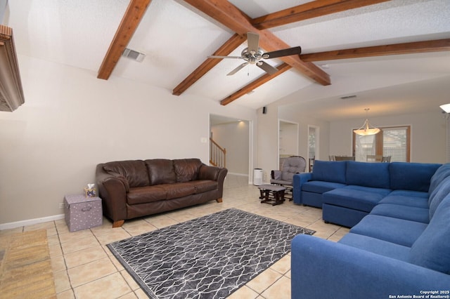 tiled living room featuring ceiling fan and vaulted ceiling with beams