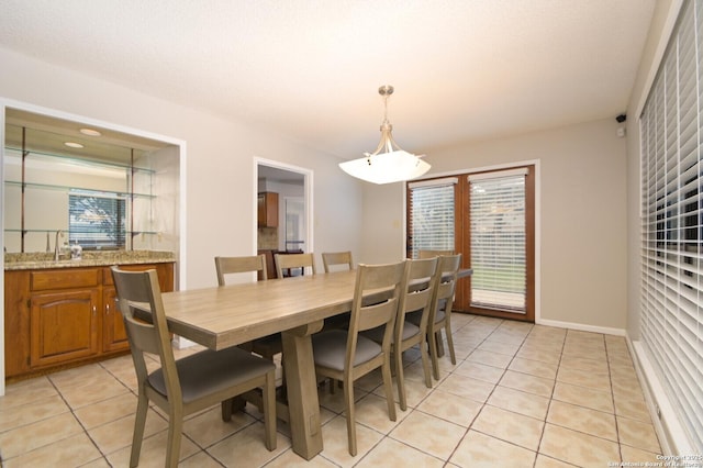 dining area featuring light tile patterned floors