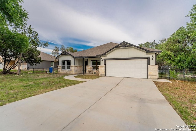 view of front of home with a front lawn and a garage