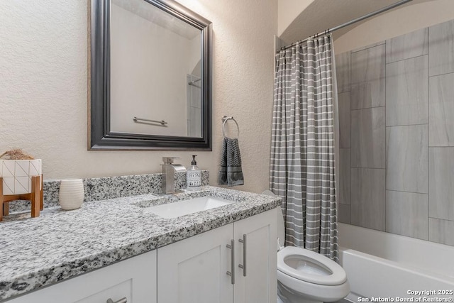 full bathroom featuring toilet, shower / bath combination with curtain, and vanity