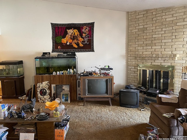 carpeted living room with a brick fireplace, a textured ceiling, and lofted ceiling