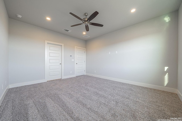 unfurnished bedroom featuring ceiling fan and carpet