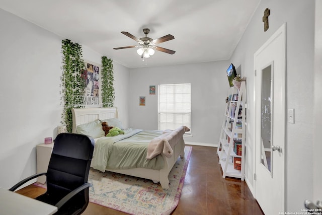 bedroom featuring ceiling fan and dark hardwood / wood-style flooring