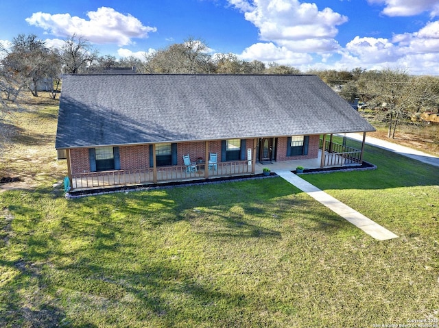 view of front facade featuring a front lawn and a porch