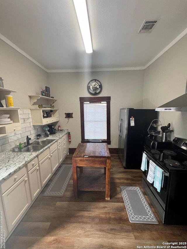 kitchen featuring white cabinets, sink, dark hardwood / wood-style floors, light stone counters, and electric range