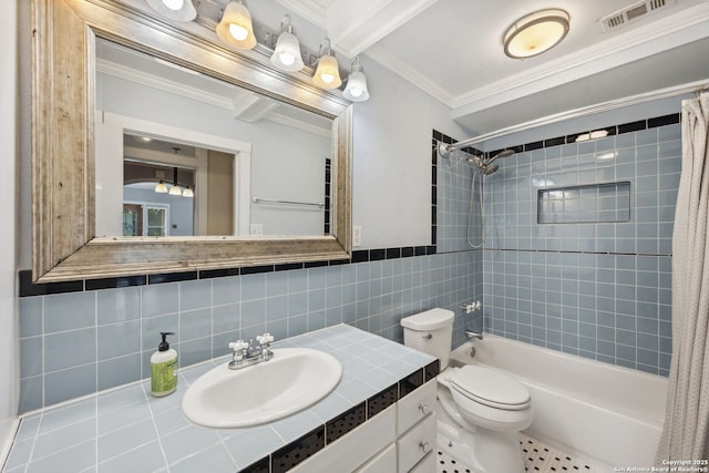 full bathroom with crown molding, shower / bath combo with shower curtain, toilet, tile walls, and visible vents