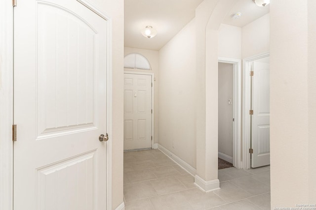 hallway featuring light tile patterned flooring