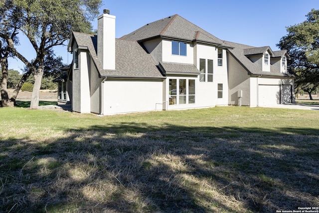 back of house with a lawn