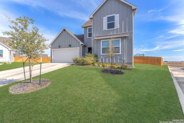 view of front of property with a front lawn and a garage