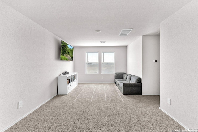 unfurnished room with light carpet