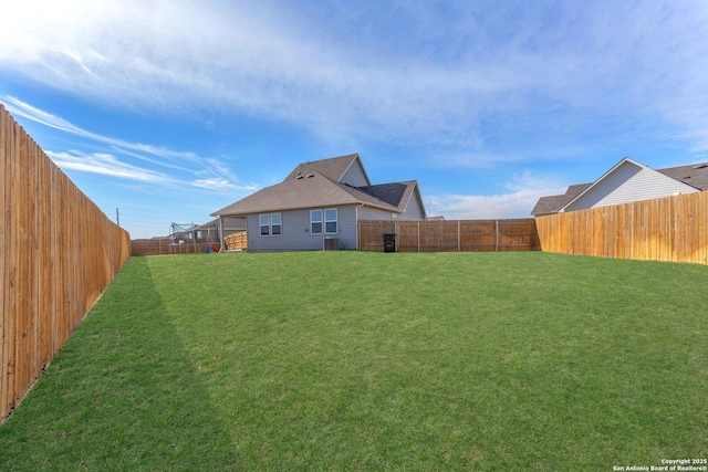 rear view of house with a yard