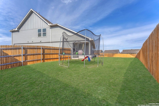 view of yard featuring a trampoline