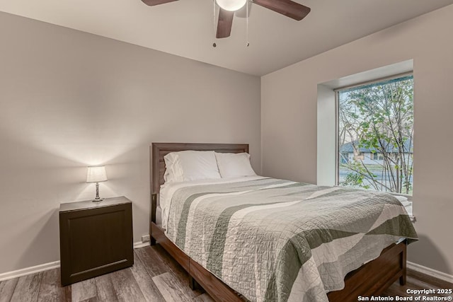 bedroom featuring ceiling fan and wood-type flooring