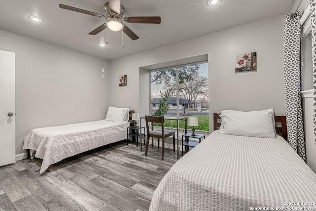 bedroom featuring hardwood / wood-style flooring and ceiling fan