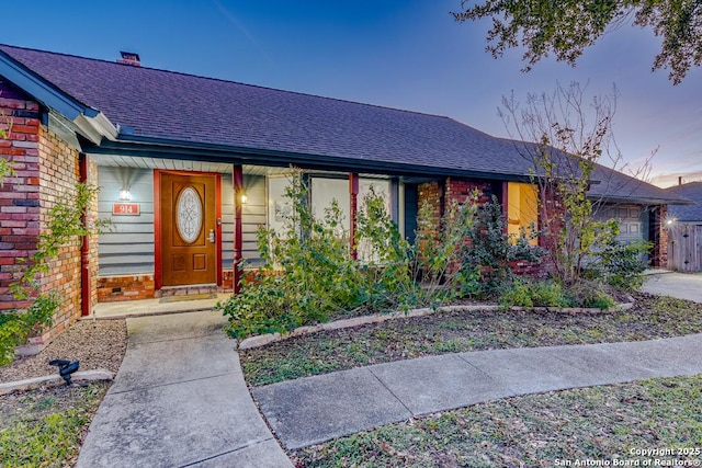 single story home with covered porch