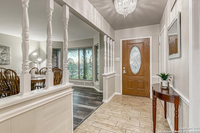 entryway with a notable chandelier