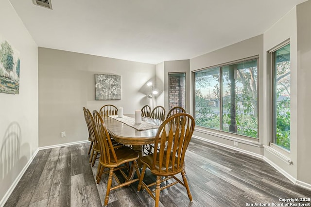 dining space featuring dark hardwood / wood-style flooring