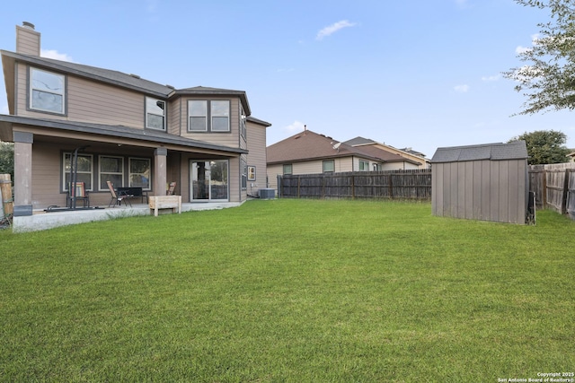 view of yard with a patio area and a shed