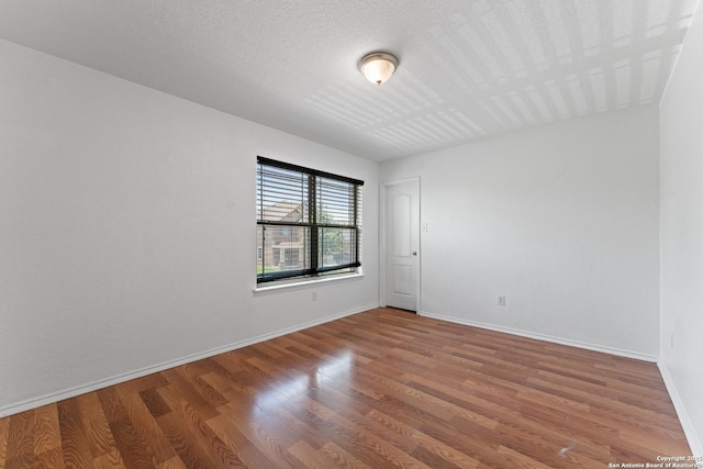 1326 Big Lk, San Antonio, TX 78245 - unfurnished room with wood finished floors and baseboards