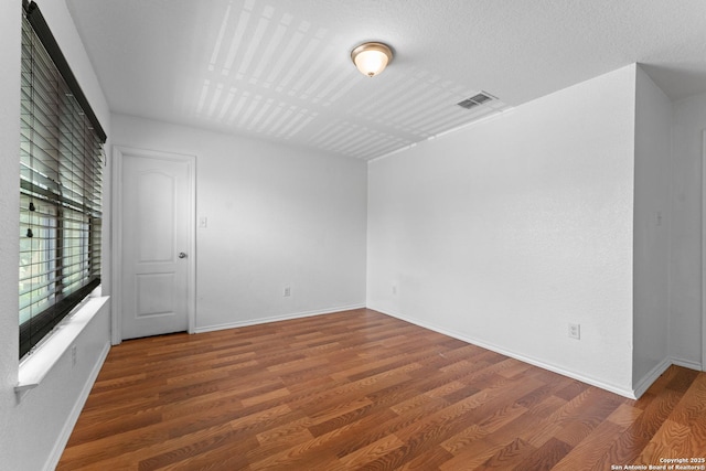 1326 Big Lk, San Antonio, TX 78245 - unfurnished room featuring wood finished floors and baseboards