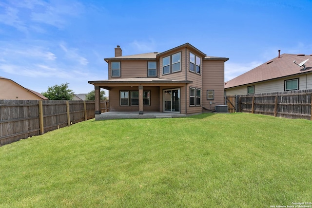 1326 Big Lk, San Antonio, TX 78245 - back of house with a chimney, a patio, and central air condition unit