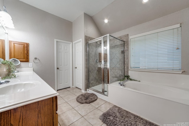 bathroom with vanity, lofted ceiling, tile patterned floors, and separate shower and tub