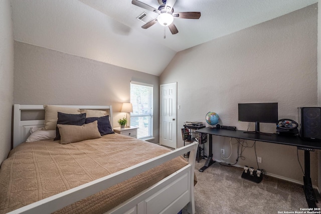 carpeted bedroom featuring vaulted ceiling and ceiling fan