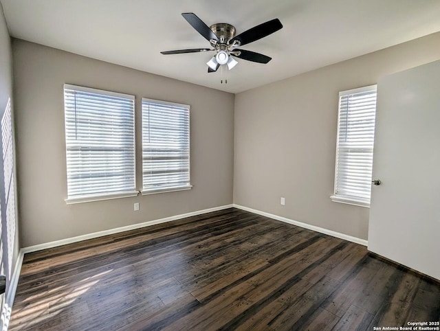 unfurnished room with ceiling fan, a healthy amount of sunlight, and dark hardwood / wood-style floors