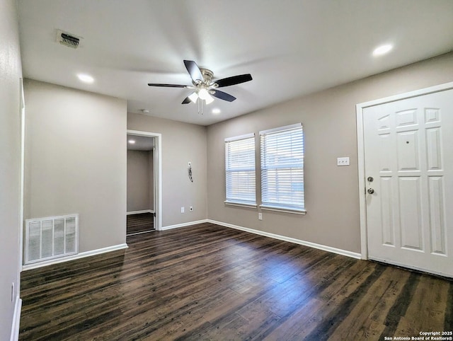 foyer with ceiling fan and dark hardwood / wood-style floors