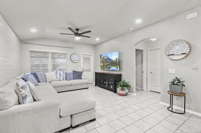 tiled living room featuring ceiling fan