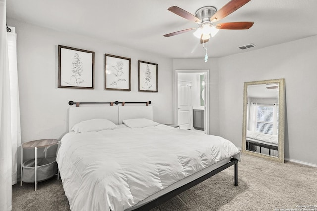 carpeted bedroom with ceiling fan and ensuite bath